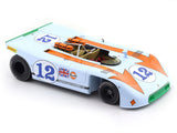 Model race car with number 12 on a white background