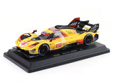 Yellow race car model on a black base with visible branding