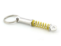 Shock absorber yellow metal keyring / keychain