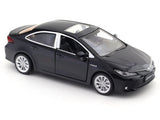 Black toy car model on a white background