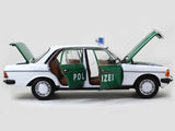 1980 Mercedes Benz 200 Polizei with Figure 1:18 Norev dealer edition scale model.