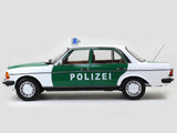 1980 Mercedes Benz 200 Polizei with Figure 1:18 Norev dealer edition scale model.