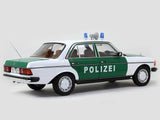 1980 Mercedes Benz 200 Polizei with Figure 1:18 Norev dealer edition scale model.
