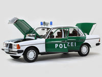 1980 Mercedes Benz 200 Polizei with Figure 1:18 Norev dealer edition scale model.