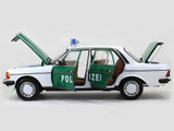 1980 Mercedes Benz 200 Polizei with Figure 1:18 Norev dealer edition scale model.