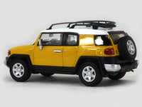 Toyota FJ Cruiser yellow 1:64 Stance Hunters diecast scale model car.